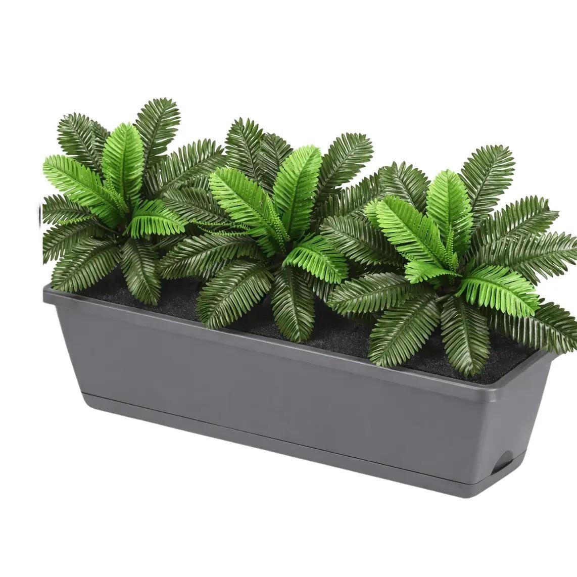 Artificial Raphis Palm plant in a plastic planter pot, 30cm tall, with lush green fronds for decorative indoor use.