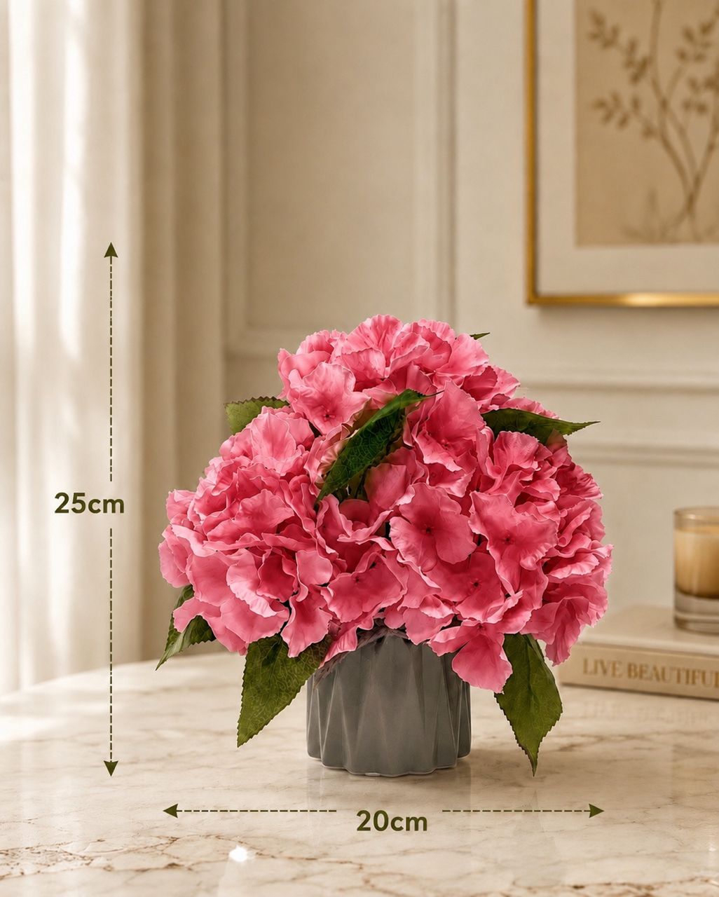 Artificial hydrangea flower in a pot by Alton Flowers, featuring reddish blooms and lush green leaves.
