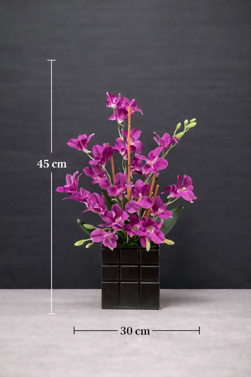 All purple artificial orchid flower arrangement by Alton Flowers, featuring detailed purple orchid blooms in a decorative display.
