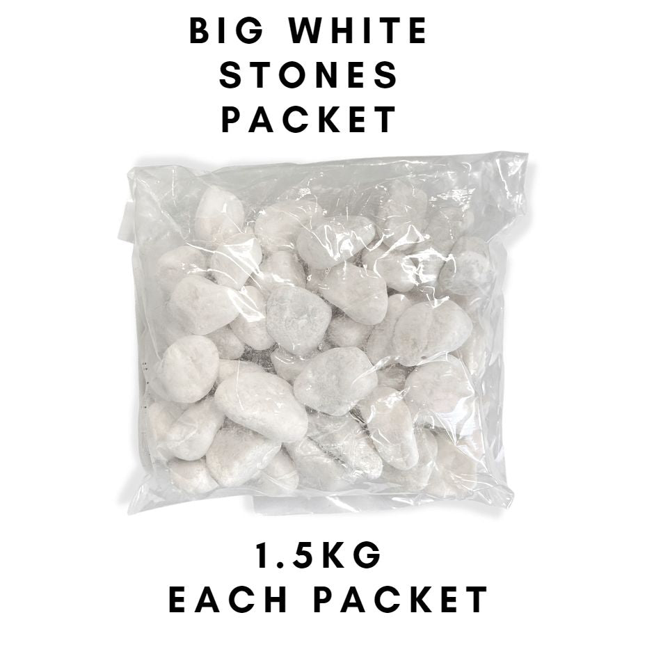 White decorative pebbles for plant arrangements, garden décor, and home decoration from Alton Flowers, shown in a garden setting.