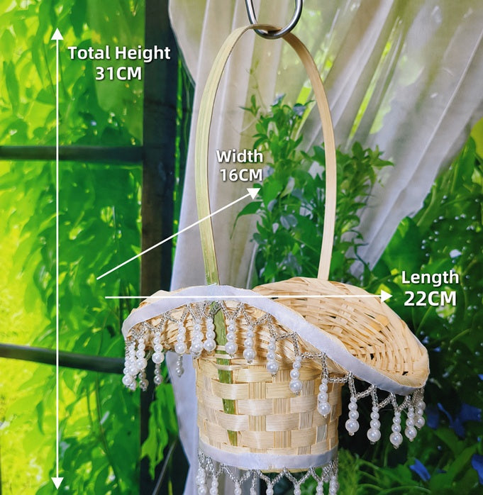 Handmade woven flower girl basket by Alton Flowers, portable bridal decor for wedding parties with floral accents.