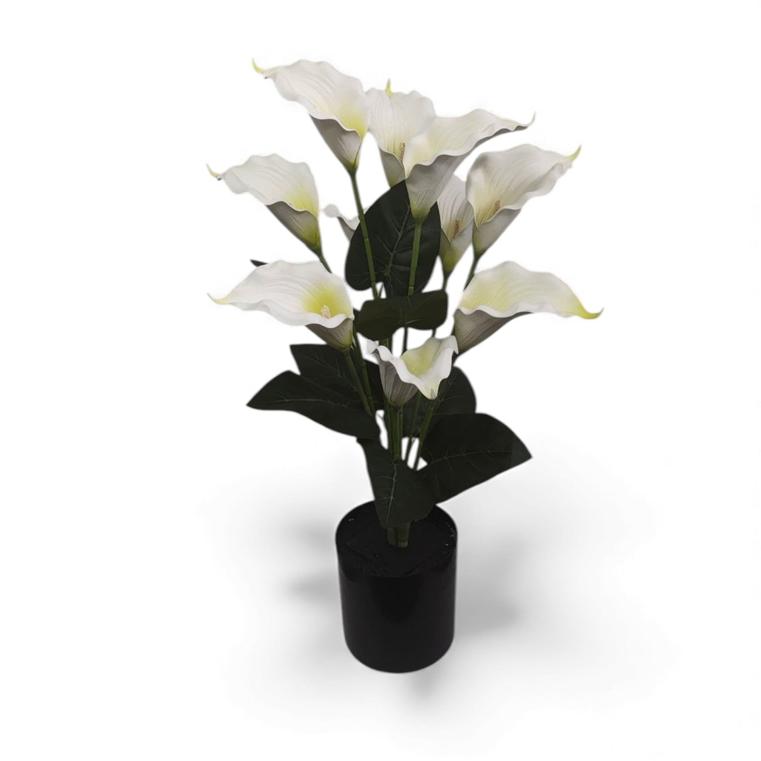 Artificial white calla lily plant with deep green leaves set in a simple black pot, perfect for home or office decor.
