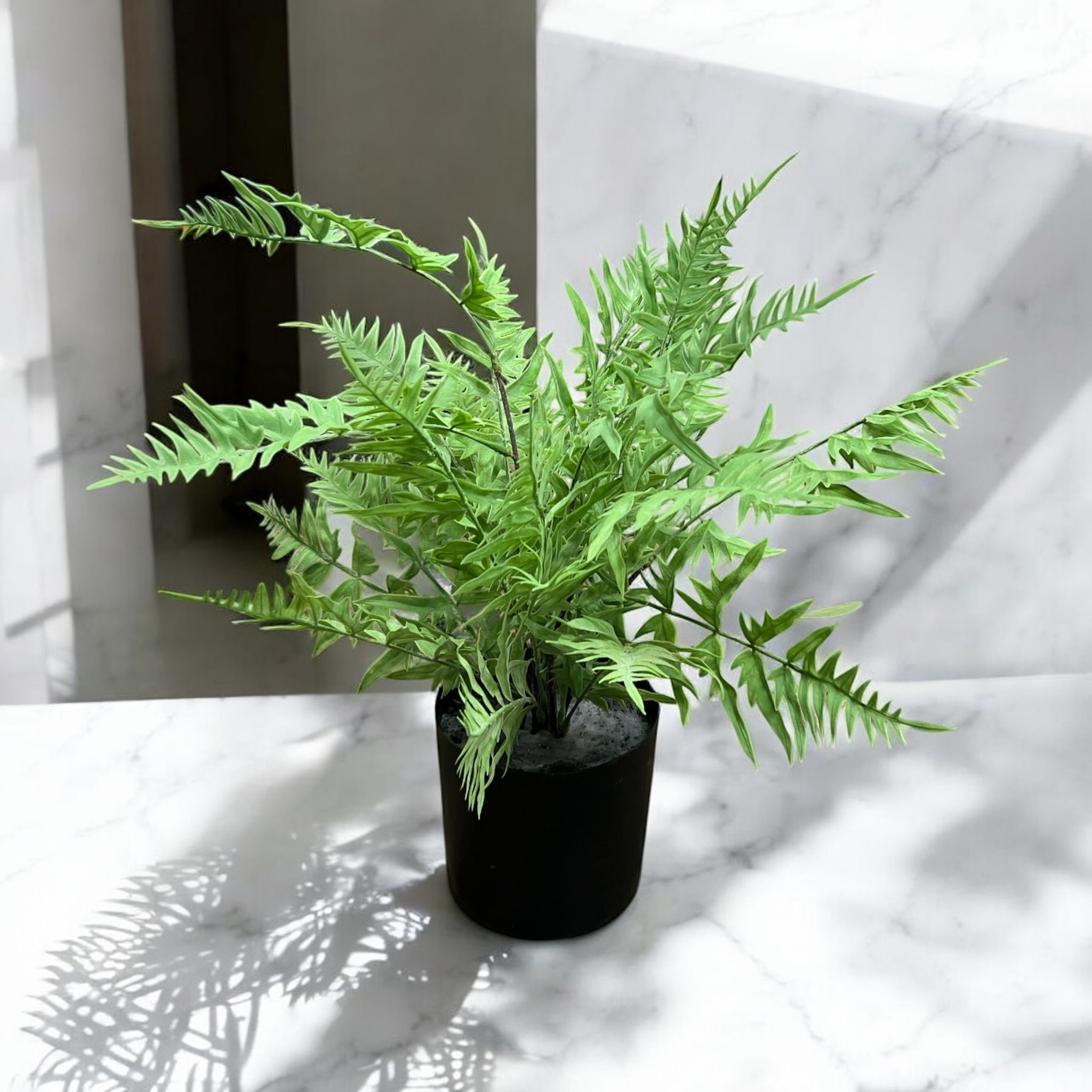Artificial fern plant in a plastic pot, 55cm tall, ideal for home, office, balcony, or corridor decor by Alton Flowers.