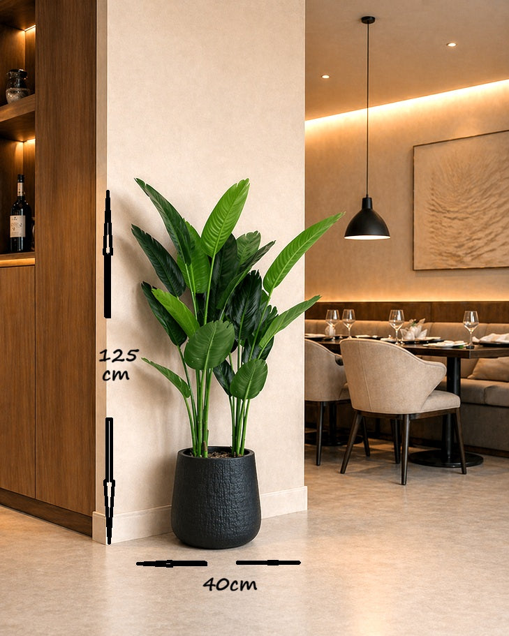 Artificial traveller plant in a planter pot, 125cm tall, by Alton Flowers, showcasing lush green foliage in a decorative container.