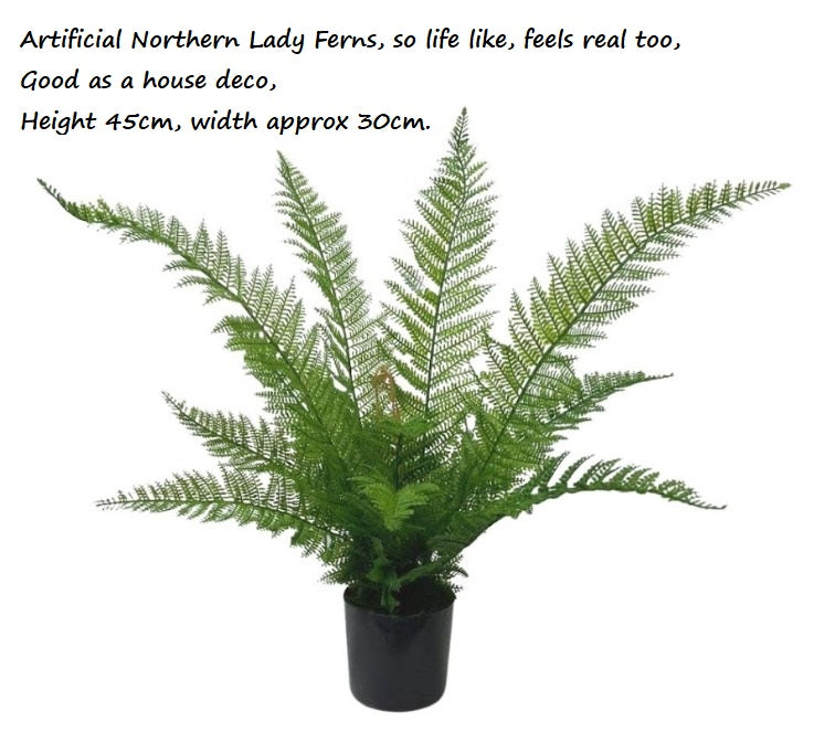 Faux green Boston fern in a black plastic pot for home decor.