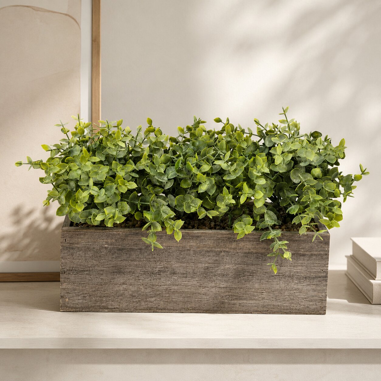 Artificial eucalyptus plant in wooden rectangular pot, tabletop greenery arrangement by Alton Flowers.