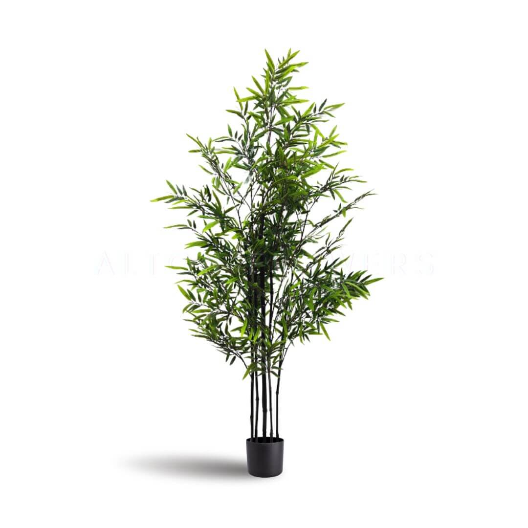 Artificial purple bamboo plant in a decorative pot, Alton Flowers' Zen-style faux plant for home, garden, or event decor.