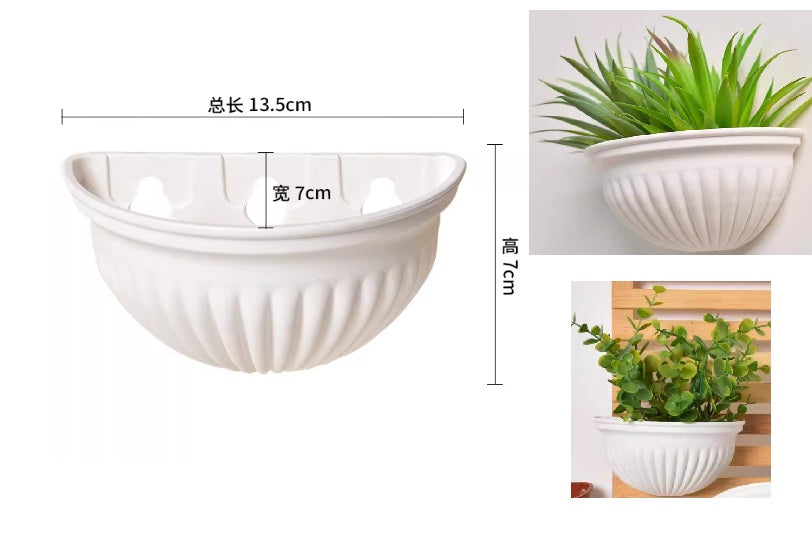Plastic wall hanging planter pot by Alton Flowers with a sleek design, suitable for indoor or outdoor plant display.