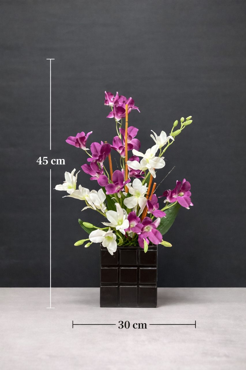 Artificial orchid flower arrangement with purple and white blooms by Alton Flowers, featuring lush, realistic orchid flowers.