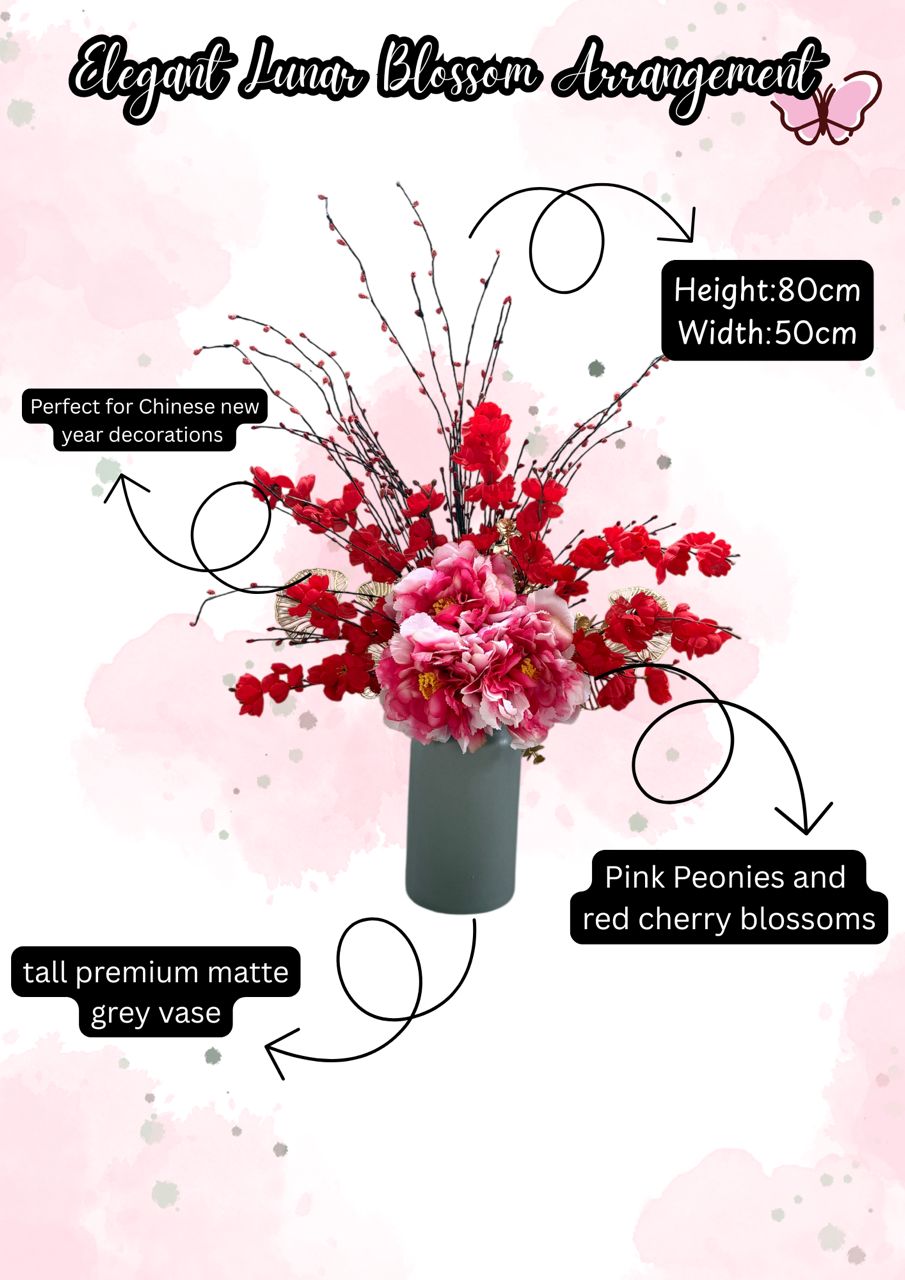 Floral arrangement with pink peonies and red cherry blossoms in a tall premium matte grey vase on a pink background.