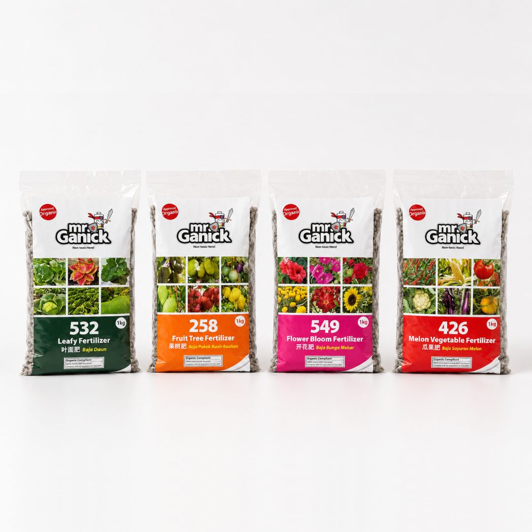 Mr Ganick Plant Fertiliser 1kg bag for leafy, fruit, flower, and vegetable plants, with fresh green leaves and colorful flowers visible.