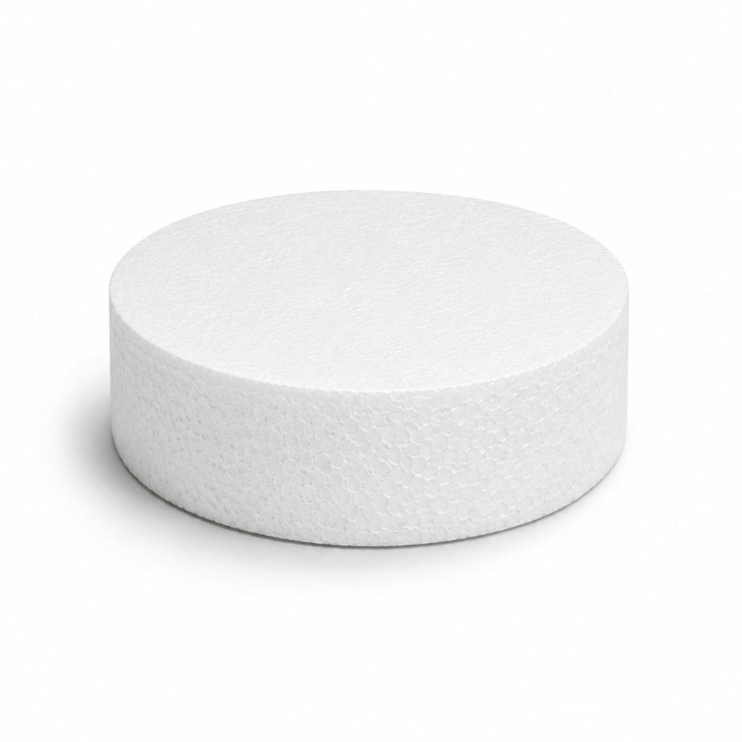 A 6 inch round by 2 inch thick solid white circular styrofoam polyfoam disc on a clean background.