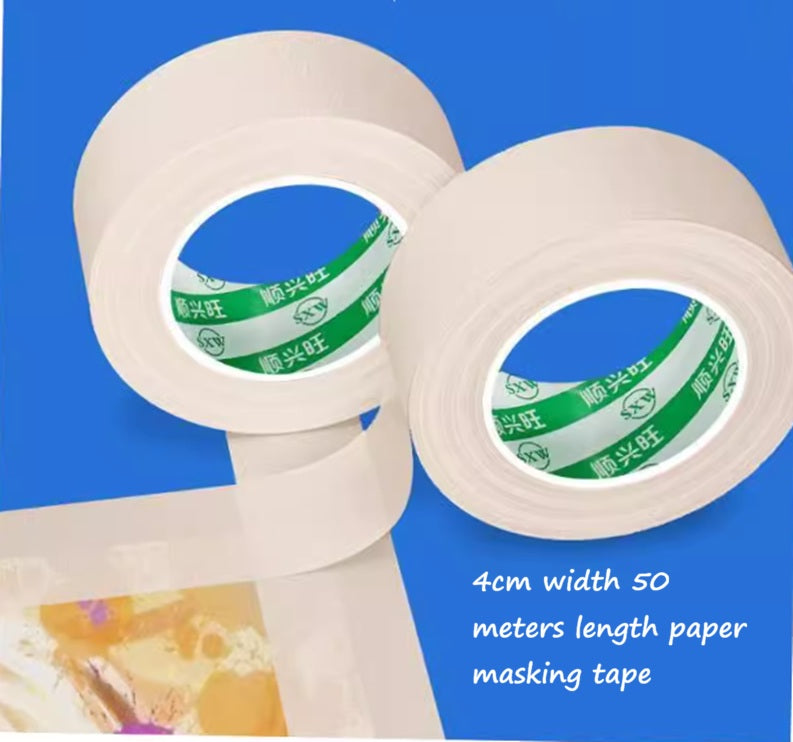 Two rolls of paper masking tape with visible brand logo on a blue background.