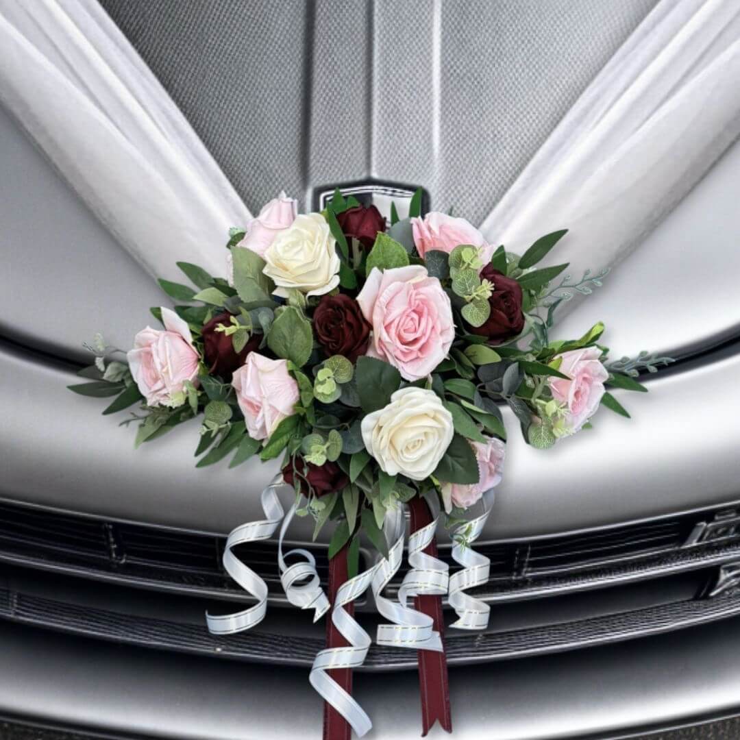 Alton Flowers Splendour wedding car bonnet bouquet with elegant white and green floral arrangements on a vintage car.