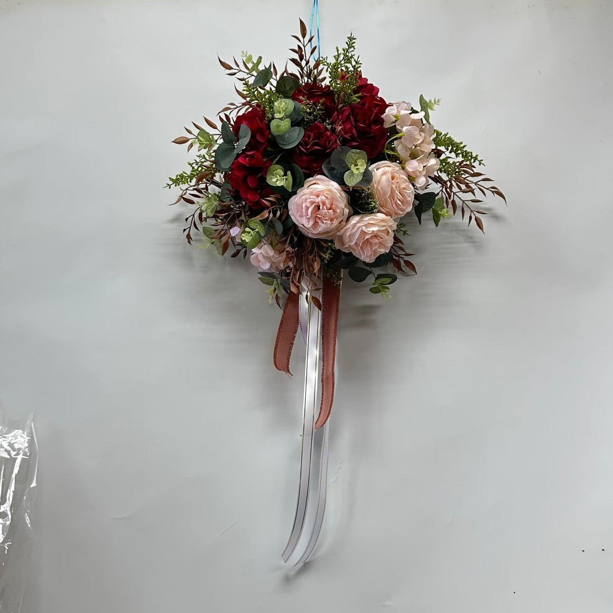 Luxury wedding car floral arrangement by Alton Flowers featuring elegant fresh flowers and greenery for special occasions.