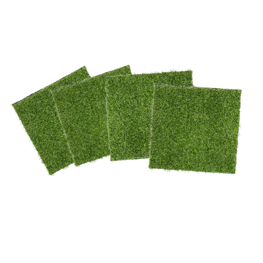 Artificial grass panels in green colour arranged on white background for wall decor and landscaping use