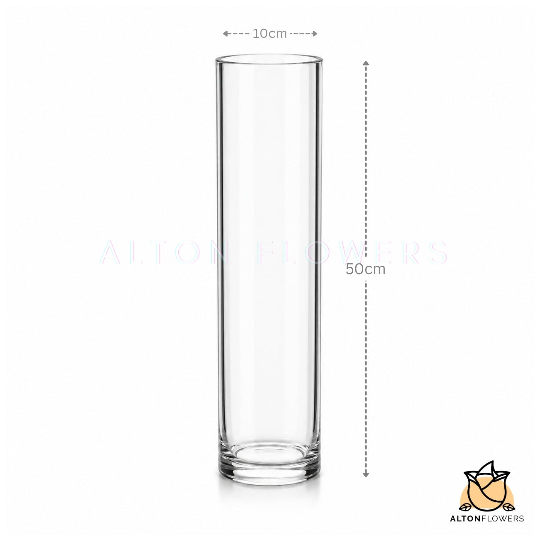 Tall 50cm slim clear glass vase from Alton Flowers, ideal for floral arrangements, with a sleek cylindrical design.